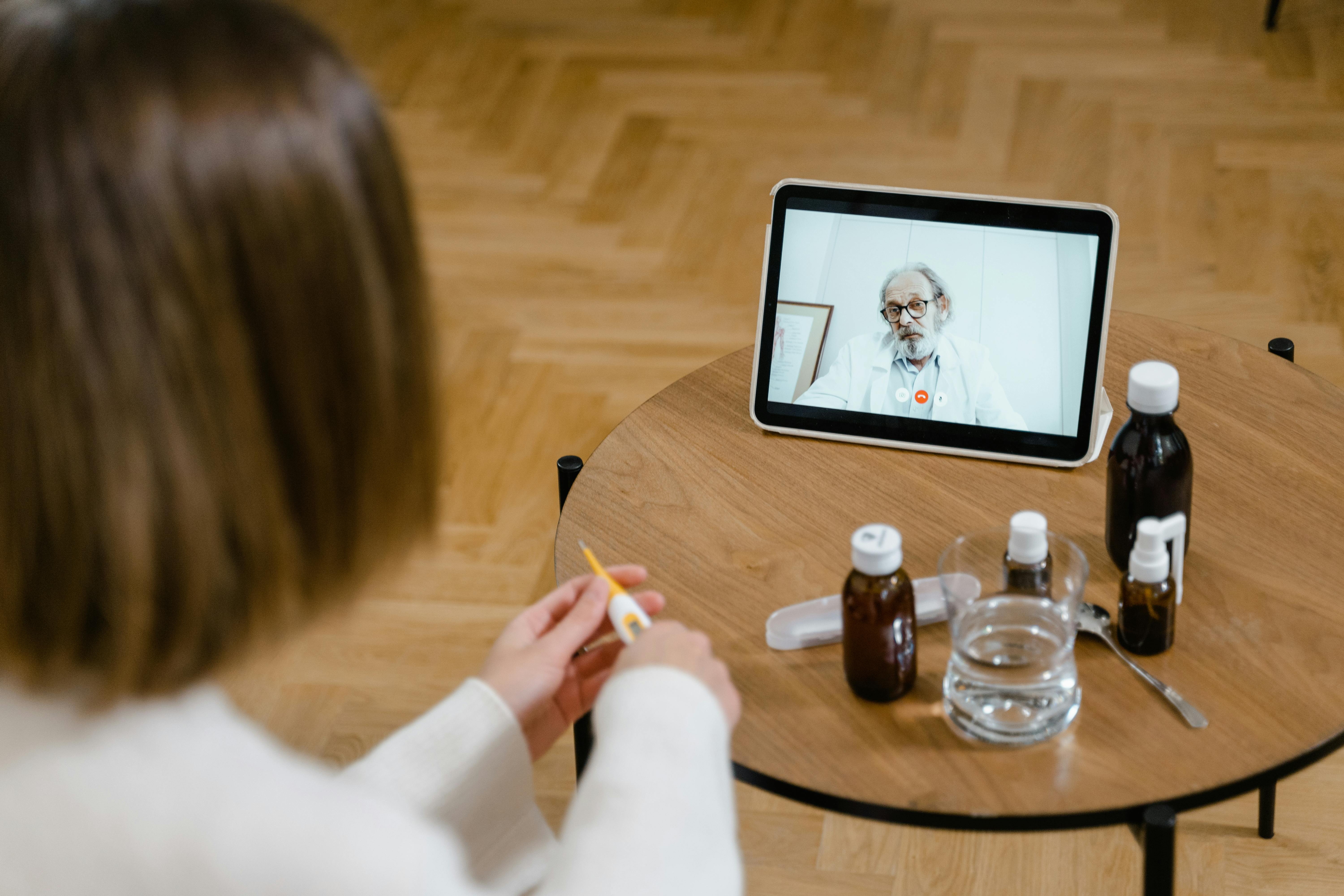 Person on video call with doctor